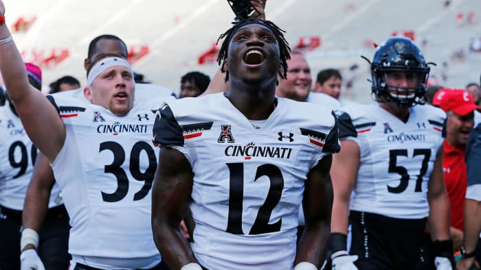Cincinnati Bearcats players celebrate the win at Indiana